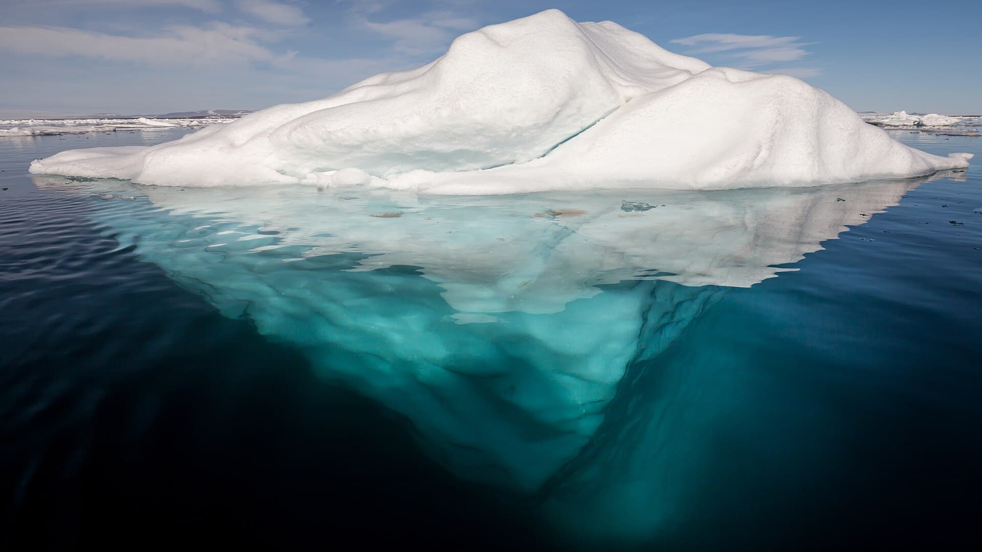 An iceberg with its underwater mass exposed — the part you never see